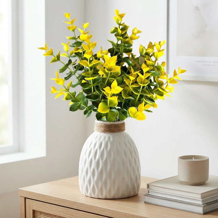گل مصنوعی بوته برگ طرح شمشاد، ابعاد 35×25×15 سانتیمتر، وزن 68 گرم، جنس پلاستیک، بوته قابل شستشو، شاخههای فنری قابل فرمدهی